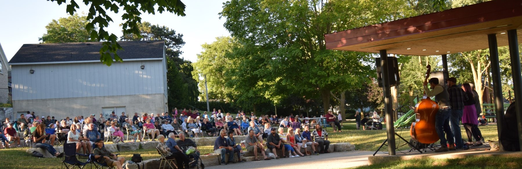 Musicians playing for a crowd in park