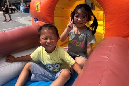 Children in an inflatable toy at a festival