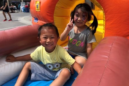 Children playin on inflatable toy at festival