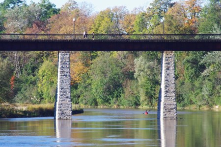 Span of trestle bridge over river 