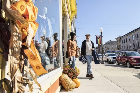 Customers walking with bags outside store
