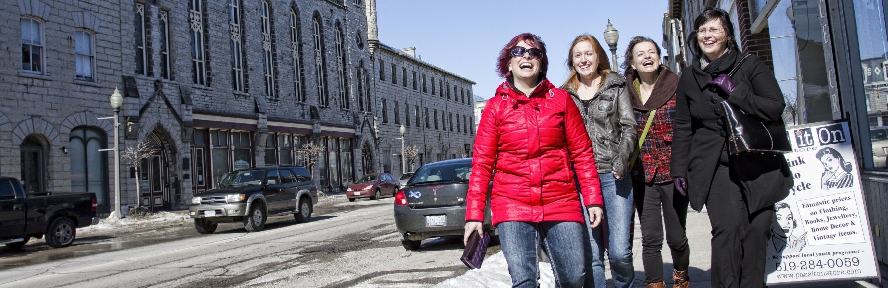 Four ladies walking down street