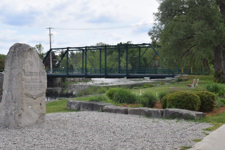 Park with green bridge in background